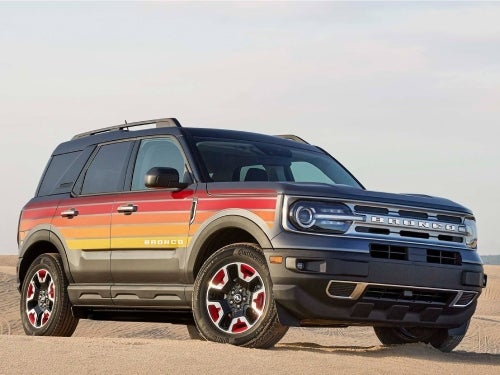 2024 Ford Bronco Sport exterior side view of vehicle parked on sand hill