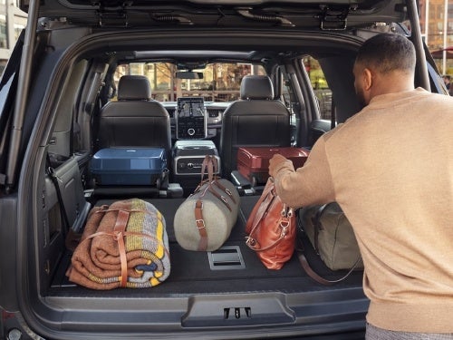 2024 Ford Expedition view from the back with the seats down showing cargo area loaded