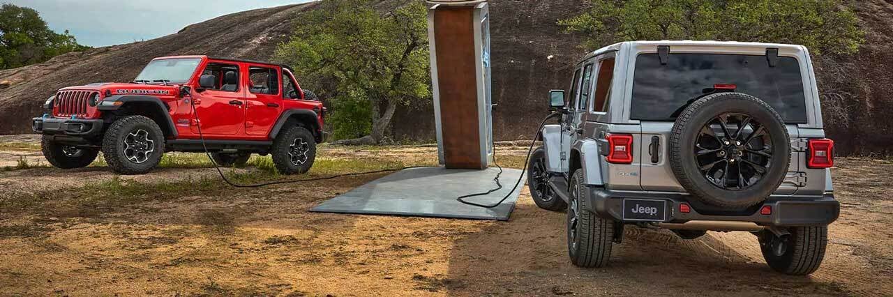 View of Jeep Wranglers at a charging station