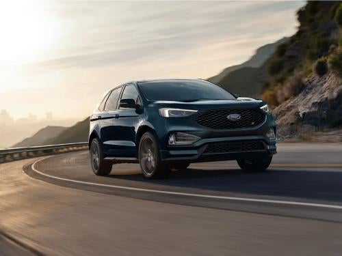 2023 Ford Edge driving around a curve