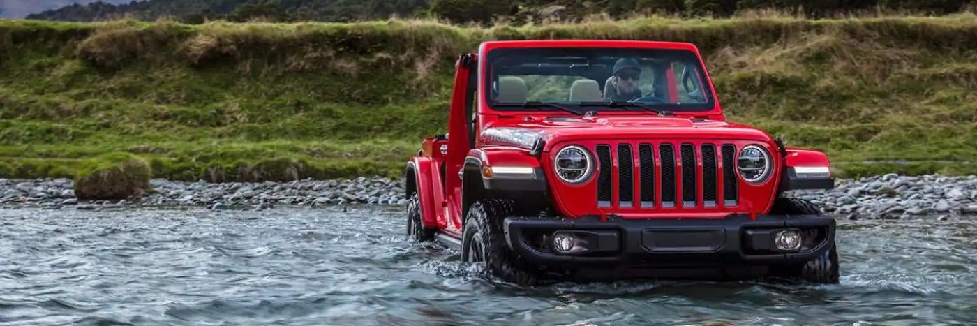 Jeep crossing a stream