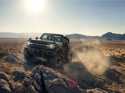 2024 Ford Bronco off-roading over rocky terrain