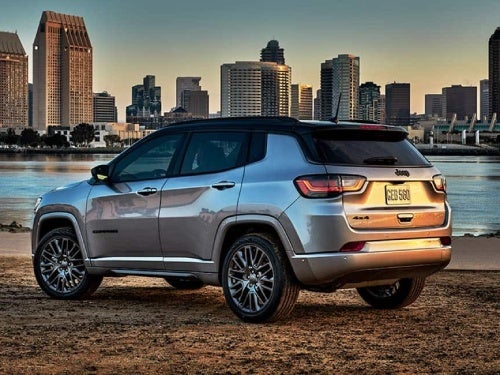 2024 Jeep Compass exterior view of vehicle parked next to a waterway outside a city