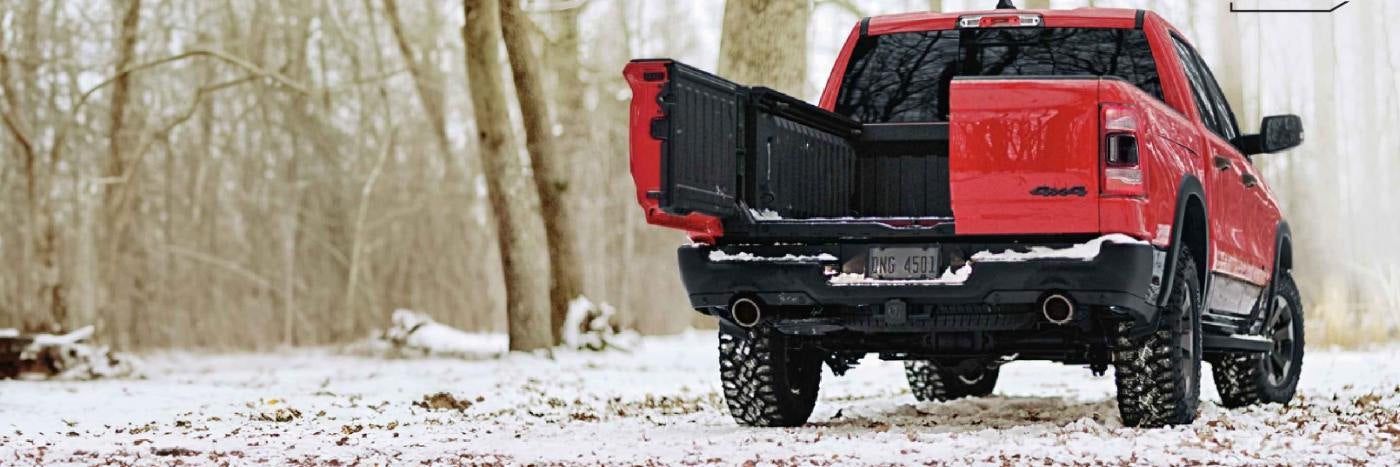 Rear view of 2024 RAM 1500 parked in the snow